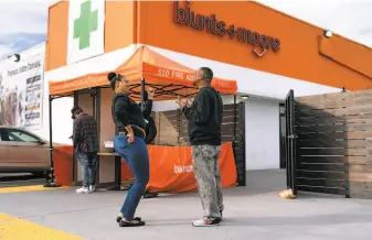  ?? Photos by Paul Kuroda / Special to The Chronicle ?? Owners Brittany Moore and Alphonso Blunt received one of four equity business permits to sell cannabis products at Blunts+Moore across the street from the Coliseum in Oakland.