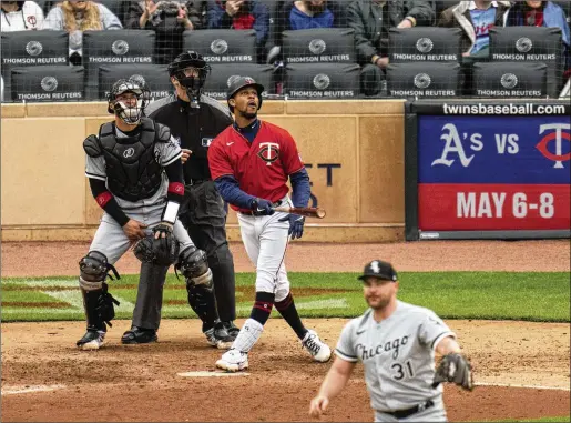  ?? JERRY HOLT/STAR TRIBUNE VIA ASSOCIATED PRESS ?? Twins outfielder Byron Buxton, who was drafted out of Appling County High School in Georgia, watches his three-run home run off White Sox closer Liam Hendriks in the 10th inning of an April 24 game in Minneapoli­s. The blast gave the Twins a come-from-behind 6-4 victory.