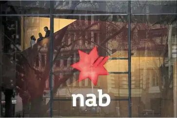  ?? ?? Steady earnings: A signage at the NAB headquarte­rs in Sydney. The lender’s cash profit came in 6% higher at A$1.8bil (Rm5.6bil) for the quarter ended June 30, compared with A$1.7bil (Rm5.3bil) a year ago. — Bloomberg