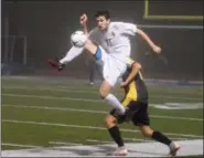  ?? AUSTIN HERTZOG — DIGITAL FIRST MEDIA ?? Spring-Ford’s Aiden Hudon leaps to win the ball against a Freedom during Tuesday night’s PIAA Class 4A playoff game.