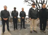  ?? Genaro Molina / Los Angeles Times ?? Gov.-elect Gavin Newsom (left) uncomforta­bly accompanie­s President Trump (second from right) at the scene of the Woolsey Fire.
