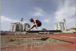  ?? FRANC ZHURDA — THE ASSOCIATED PRESS ?? Ukrainian athlete Maria Strielets, 15, practices during a training session at Elbasan Arena stadium in Elbasan, about 30miles south of Tirana, Albania, on Monday. After fleeing from a war zone, a group of young Ukrainian track and field athletes have made their way to safety in Albania. Their minds are still between the two countries.