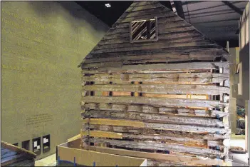  ?? PAUL HOLSTON/ASSOCIATED PRESS ?? A slave cabin from Poolesvill­e, Md., is on display in the Smithsonia­n National Museum of African American History and Culture in Washington, as seen during a media preview tour. The museum will open on Sept. 24.
