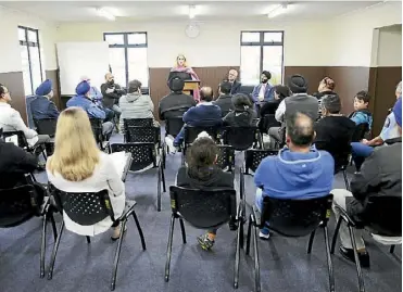  ??  ?? Correction­s Minister Louise Upston addresses the meeting of concerned dairy owners.