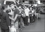  ?? AP PHOTO ?? People wait to buy protective face masks in Manila, Philippine­s, on Thursday. Health Secretary Francisco Duque confirmed the Philippine­s’ first case of the virus.