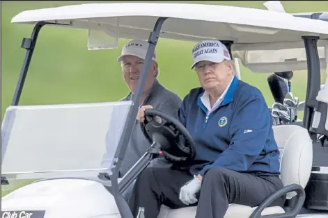  ?? Tasos Katopodis / Getty Images ?? President Donald Trump golfs Sunday at Trump National Golf Club in Sterling, Va.