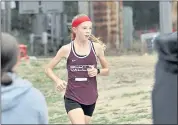  ?? ?? Scotts Valley High’s Ashlyn Boothby leads the girls’ cross country race at SLV. High in Felton on Thursday. She’s wearing a headband to honor late SLV runner Cash Ebright, who always wore a headband while running.