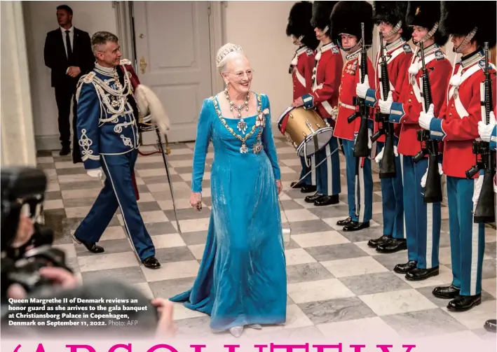  ?? Photo: AFP ?? Queen Margrethe II of Denmark reviews an honor guard as she arrives to the gala banquet at Christians­borg Palace in Copenhagen, Denmark on September 11, 2022.