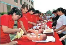  ?? WANG JINBO / FOR CHINA DAILY ?? Maternity matrons are offered training at a vocational school in Hanbin district of Ankang, Shaanxi province, on Aug 12, 2015. The district provides skill training in 25 industries.