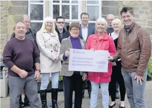  ??  ?? Council leader Miles Parkinson with Lynn Wilson and other supporters of Churchfiel­d House in Great Harwood