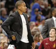  ?? AP ?? Point guard Isaiah Thomas watches the Cavs play the visiting New York Knicks on Oct. 29. Thomas is making strong progress in his recovery from a hip injury.