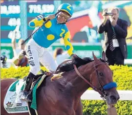  ?? Al Bello
Getty Images ?? VICTOR ESPINOZA WAS RIDING HIGH after guiding American Pharoah to victory in the Belmont Stakes, giving the colt the Triple Crown.