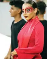  ?? — AFP photos ?? A dancer looks on after performing during a ceremony ahead of a football match between Iraq and Lebanon in the West Asian Championsh­ip at the Karbala Sports City stadium in the holy city of Karbala.