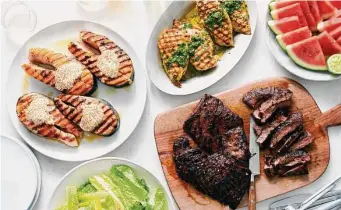  ?? Photos by David Malosh/New York Times ?? With a little practice — and these fail-proof recipes — summer cookouts will be a breeze. Enjoy, clockwise from left, grilled salmon, grilled chicken breasts and grilled steak, along with the other bounties of summer.