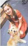  ??  ?? Jade Sullivan, who plays Annie, with Sandy, a rescue dog from the Rhea County Humane Society.