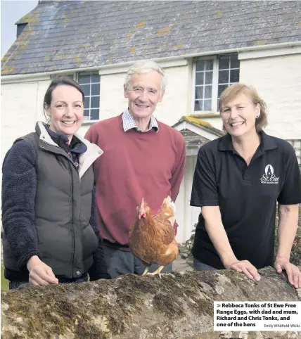  ?? Emily Whitfield-Wicks ?? Rebbeca Tonks of St Ewe Free Range Eggs, with dad and mum, Richard and Chris Tonks, and one of the hens