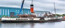  ?? WAVERLEY EXCURSIONS LTD ?? PS Waverley’s aft funnel is lifted back into position at Greenock on June 17, following the fitting of the paddle steamer’s new £2.3 million boilers.
