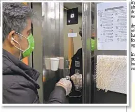  ??  ?? Sports in an empty stadium, like at Inter Milan’s San Siro (main) last week, will be norm in Italy until April 3 as a precaution against coronaviru­s. Above, man in Tehran uses stick for elevator button.