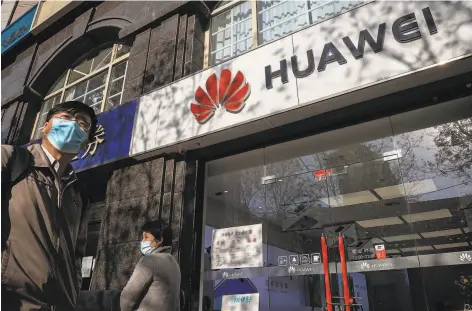  ?? Nicolas Asfouri / AFP / Getty Images ?? The White House is proposing tighter restrictio­ns on Huawei, which makes products sold in its stores like this one in Beijing.