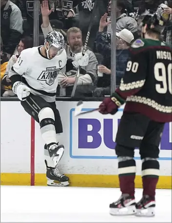  ?? MARK J. TERRILL — THE ASSOCIATED PRESS ?? The Kings’ Anze Kopitar celebrates his goal against the Arizona Coyotes during the first period Saturday night at Crypto.com Arena. The Kings, after giving up a four-goal lead, won 6-5in a shootout. ocregister.com/sports