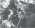  ?? RICHARD TSONGTAATA­RII/MINNEAPOLI­S STAR TRIBUNE/TNS ?? Protesters clash with police at the Brooklyn Center (Minn.) Police Department on Monday.