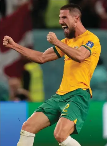  ?? ?? Australia's Milos Degenek celebrates victory in the World Cup group D soccer match between Australia and Denmark