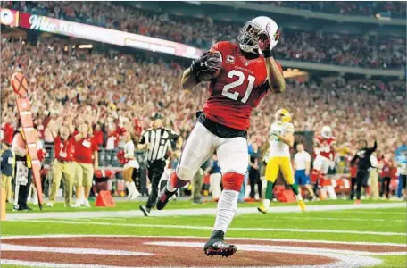  ?? Christian Petersen Getty Images ?? ARIZONA CARDINALS cornerback Patrick Peterson celebrates as he returns an intercepti­on for a touchdown.