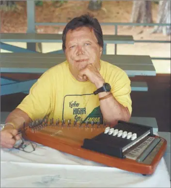  ?? VALERIE MONSON photo ?? Kalaupapa songwriter Bernard Punikai‘a is pictured with his autoharp in 1995. Local musicians are holding a virtual concert Oct. 17 to raise money for the Kalaupapa memorial and pay tribute to the Molokai settlement’s musicians and composers.