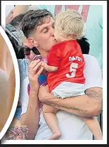  ??  ?? BIG KISS: Two-goal hero John Stones with his daughter and, left, former manager Sam Allardyce