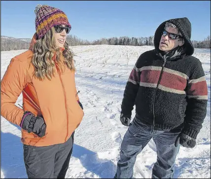  ?? CP photo ?? Megan Hodges, left, member of the Sheffield Mills Community Associatio­n and a local councillor and Michael Gautreau, area resident and member of the Sheffield Mills Eagles Watch organizing committee, visit the viewing area in Sheffield Mills, N.S.