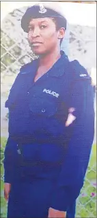  ?? ?? A photo of slain police officer Zinhle Mavuso displayed by a relative at the gravesite.