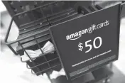  ?? Associated Press ?? Gift cards are on display May 25 at the Amazon Books store in the Time Warner Center at Columbus Circle in New York.