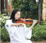  ?? STAFF PHOTO BY DOUG STRICKLAND ?? Girls Preparator­y School valedictor­ian Margaret Lim plays a violin at GPS on May 30.