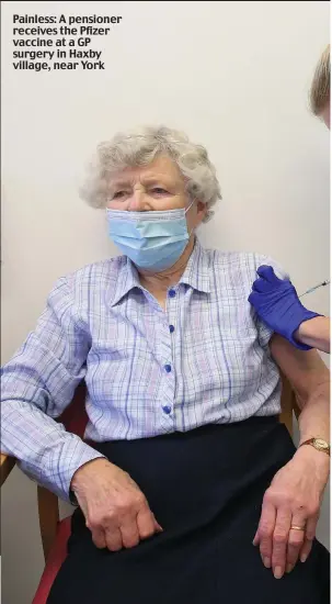  ??  ?? Painless: A pensioner receives the Pfizer vaccine at a GP surgery in Haxby village, near York