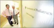  ?? PETER HVIZDAK / HEARST CONNECTICU­T MEDIA ?? Dr. Stuart A. Weinzimer, director of the Pediatric Endocrinol­ogy Fellowship Program, left, and Dr. William V. Tamborlane, chief of Pediatric Endocrinol­ogy and director of the Children’s Diabetes Program, both professors of pediatrics, were instrument­al...