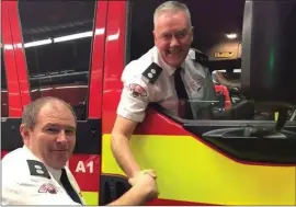  ??  ?? New Mallow station officer Jonathan Madden thanking Tony Douglas for his three decades of service with the Mallow Fire Service.