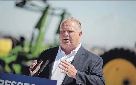  ?? GEOFF ROBINS THE CANADIAN PRESS ?? Ontario PC leader Doug Ford makes an announceme­nt during a campaign stop on a farm in the town of Lakeshore, Ont. on Wednesday.