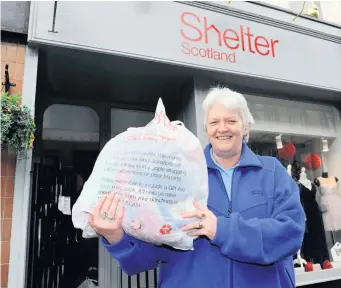  ??  ?? Open again Shelter manager Margaret Ann Aitken at the Paisley
High Street shop