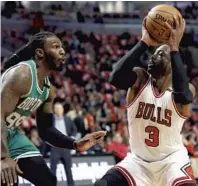  ?? NAM Y. HUH/AP ?? Dwyane Wade, right, averaged 18.3 points in 60 games for the Chicago Bulls. His player-option for next year is for $23.8 million.