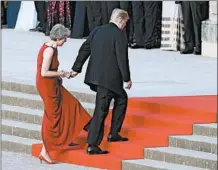  ?? WILL OLIVER/ AP ?? British Prime Minister Theresa May walks with President Donald Trump into Blenheim Palace for a black tie dinner Thursday.