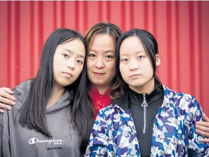  ?? Photo / Jason Oxenham ?? Eva Chen, here with daughters Claudia Wen (left) and Annemarie Wen, says things are getting unaffordab­le for families in NZ, especially for migrants when emergencie­s crop up with families abroad.
