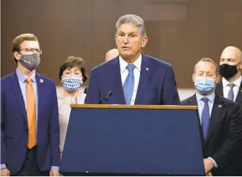  ?? TASOS KATOPODIS GETTY IMAGES ?? Sen. Joe Manchin, D-W.Va., speaks alongside a bipartisan group of senators backing a coronaviru­s relief bill.