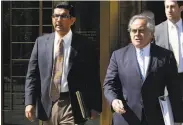  ?? Richard Drew / Associated Press 2014 ?? Conservati­ve author Dinesh D’Souza (left) pleaded guilty to making illegal campaign contributi­ons.