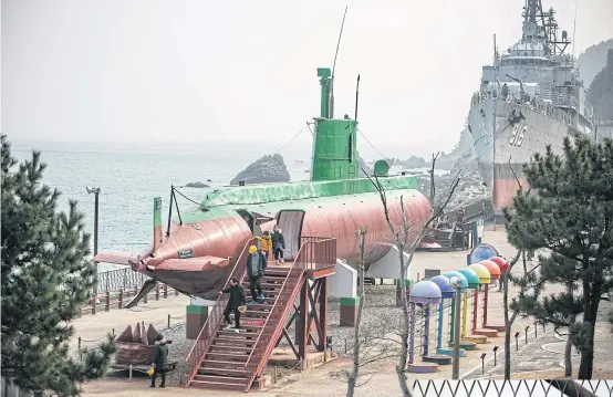  ?? BLOOMBERG ?? LEFT Visitors exit a North Korean Sang-O-class submarine that was stranded in South Korean waters in 1996 and is now on display at Tongil Park in Gangneung, Gangwon, South Korea.