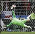  ?? MATTHIAS SCHRADER — THE ASSOCIATED PRESS ?? England goalkeeper Jordan Pickford makes saves during shootout in round of 16 match between Colombia and England at World Cup on Tuesday.