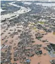  ?? AFP/GETTY IMAGES ?? Floodwater­s overwhelme­d Joso and other parts of Japan on Thursday.