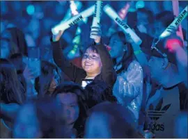  ??  ?? GLOW STICK-WAVING FANS show their enthusiasm for Shawn Mendes during the annual KIIS-FM concert at the Banc of California Stadium on Saturday.