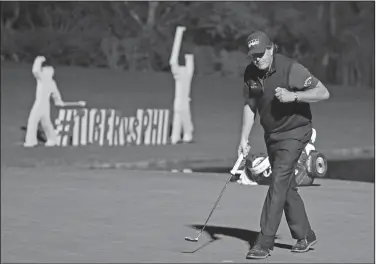  ?? Associated Press ?? Mickelson wins: Phil Mickelson celebrates after sinking a put to defeat Tiger Woods at a playoff hole in a golf match at Shadow Creek golf course Friday in Las Vegas.