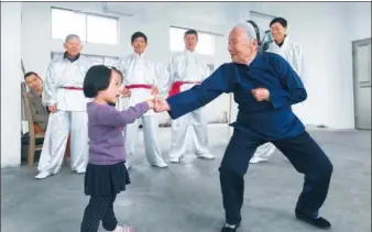  ?? ZUIXIANGLI / FOR CHINA DAILY ?? Zhang Hexian (right), 94, teaches kung fu to a girl in her village in Ninghai county, Zhejiang province, in 2016. She has had more than 100 disciples.