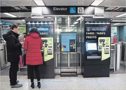  ?? NATHAN DENETTE THE CANADIAN PRESS ?? People pay at Presto machines undergroun­d in the TTC subway portals in Toronto on Tuesday, Dec. 4, 2018.